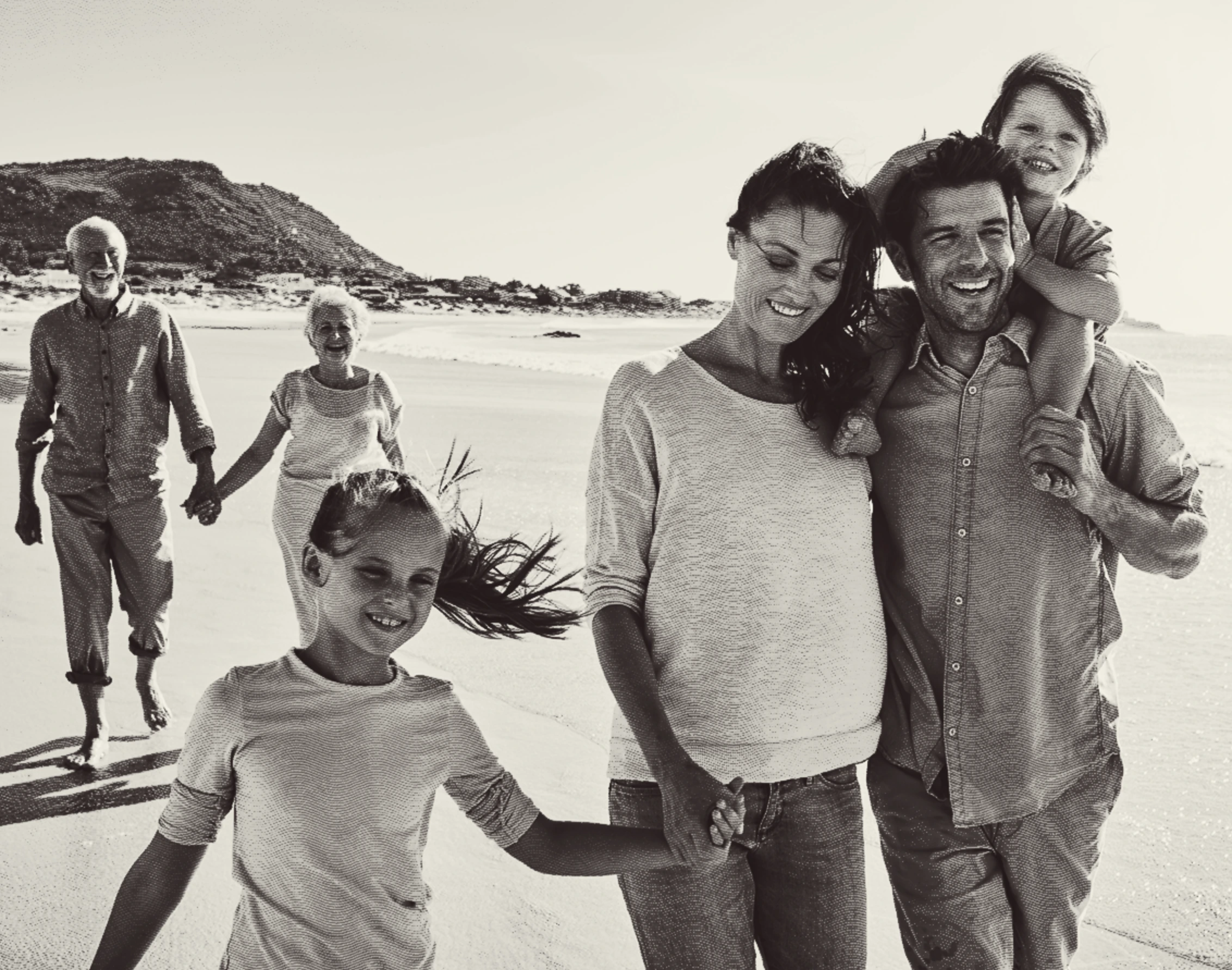 Multigenerational family walking together on a beach
